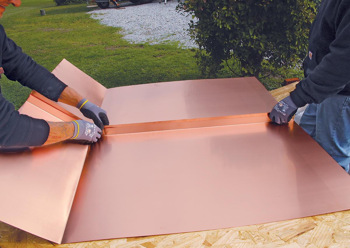 Multi-layer copper flashing system showing step flashing and counter flashing