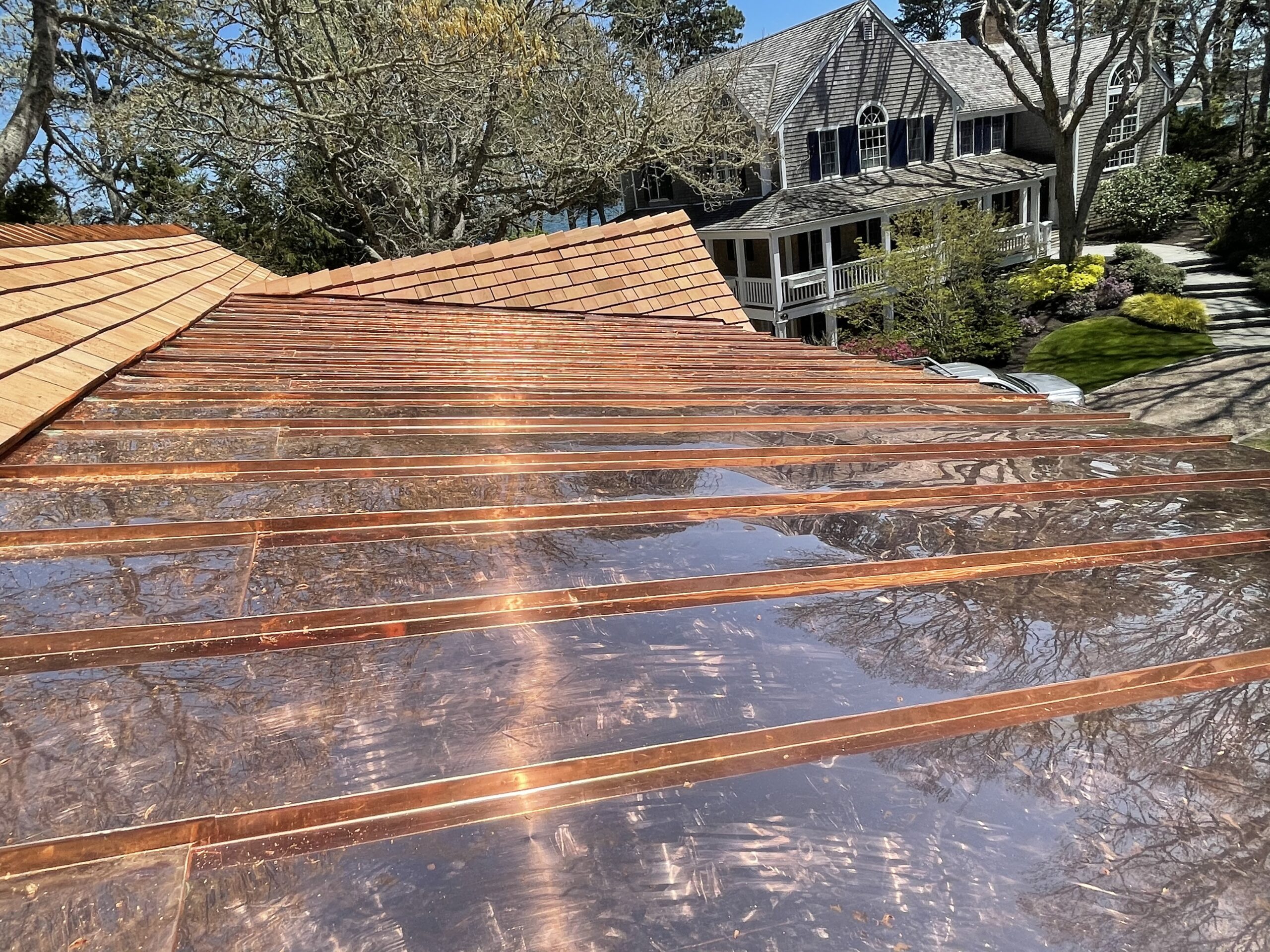 Copper gutter system installation on historic Cape Cod home