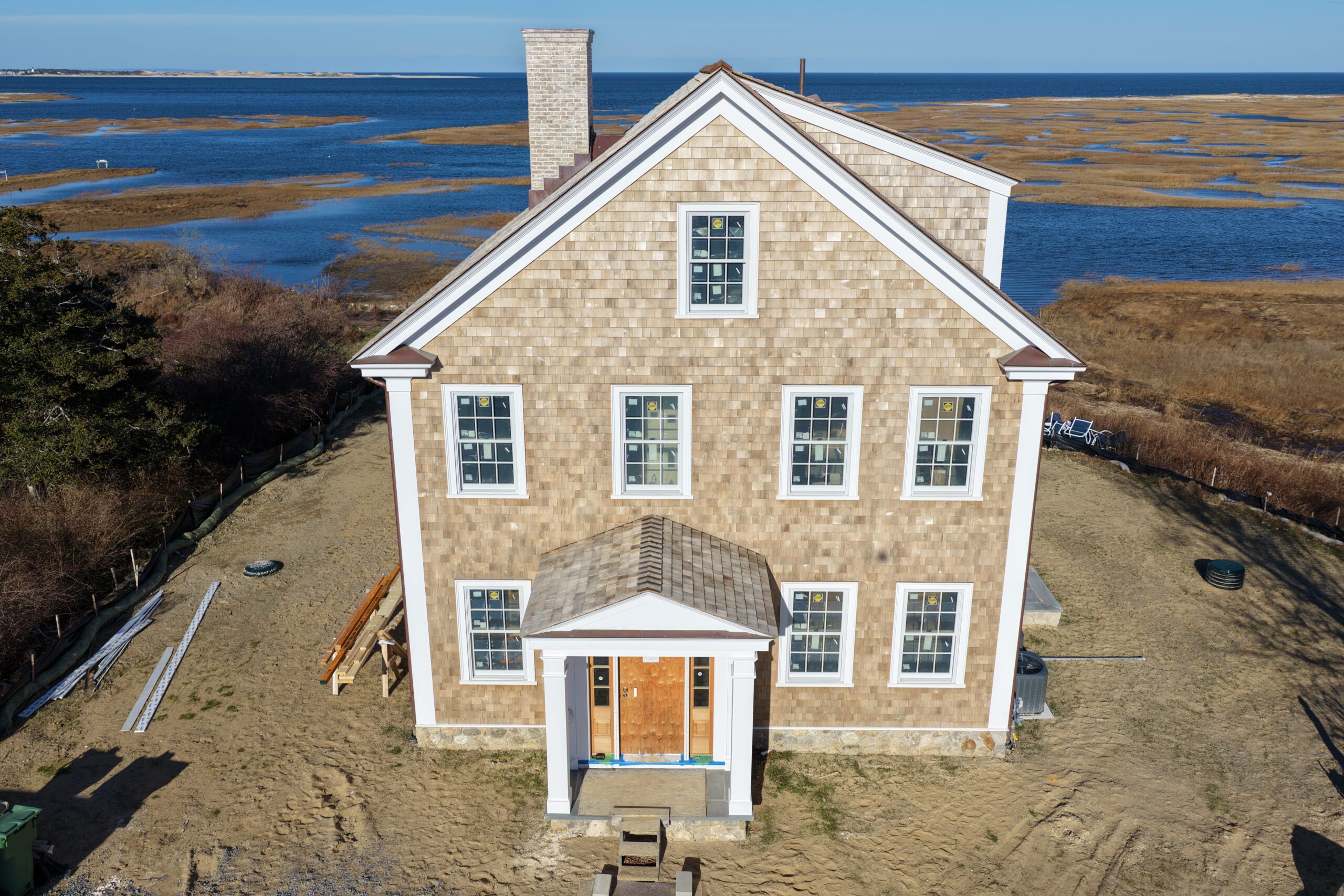 Aerial view of cedar roof and siding installation