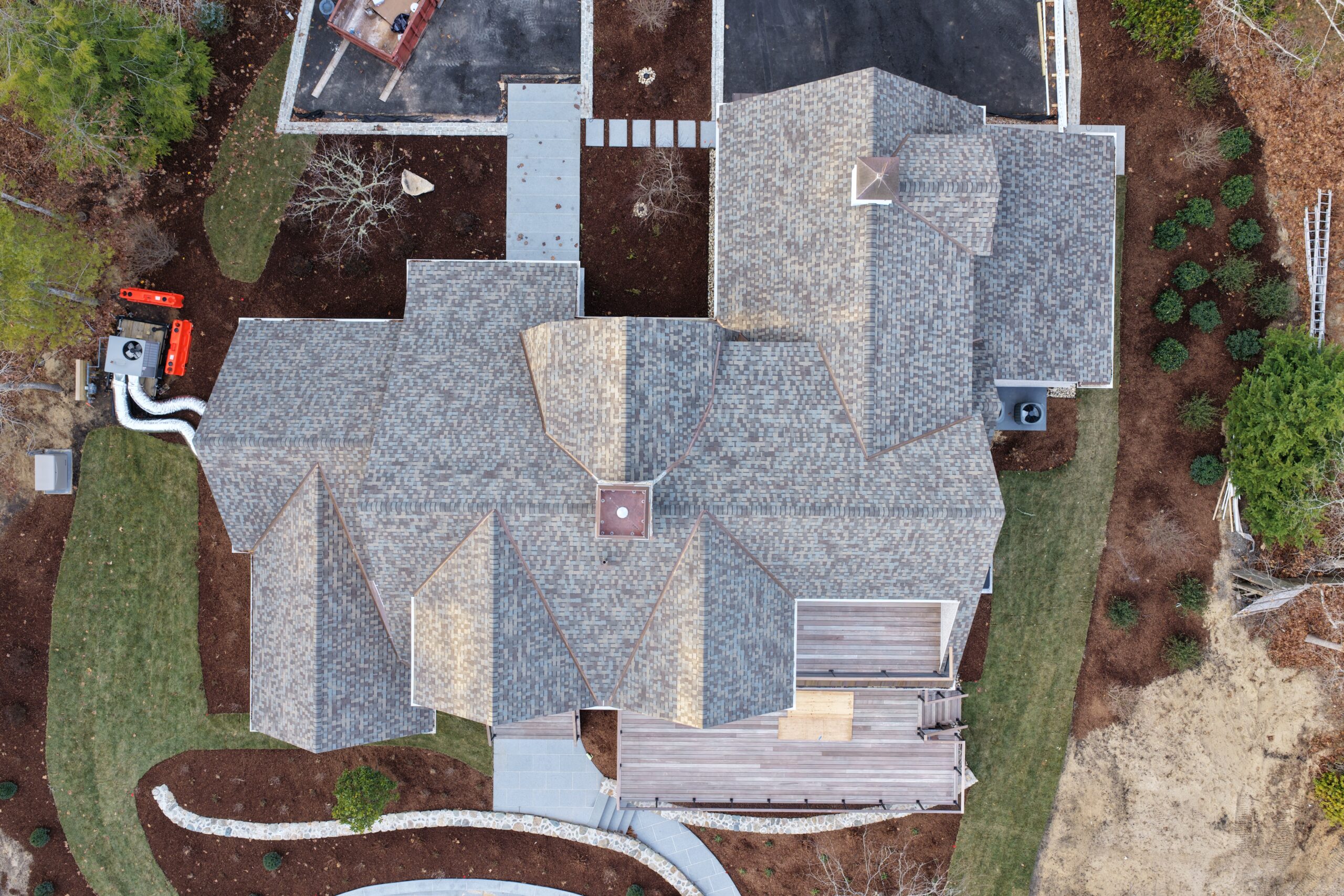 Top-down view of multi-slope asphalt shingle roof with complex architecture in Chatham