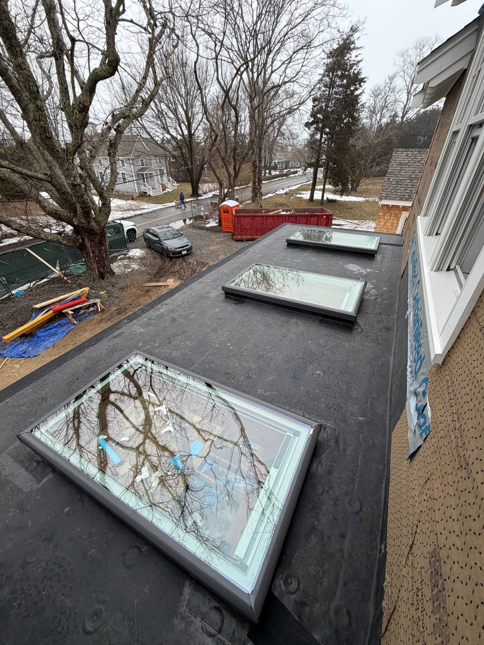 EPDM flat roof installation with skylights