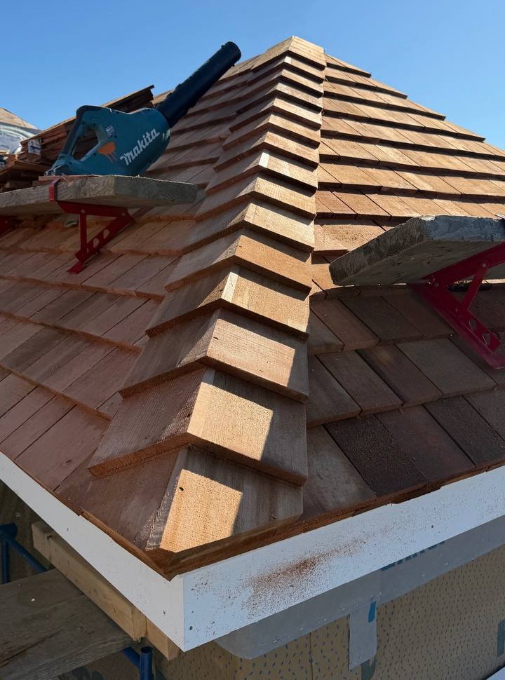 Red cedar roof with weaved caps installation