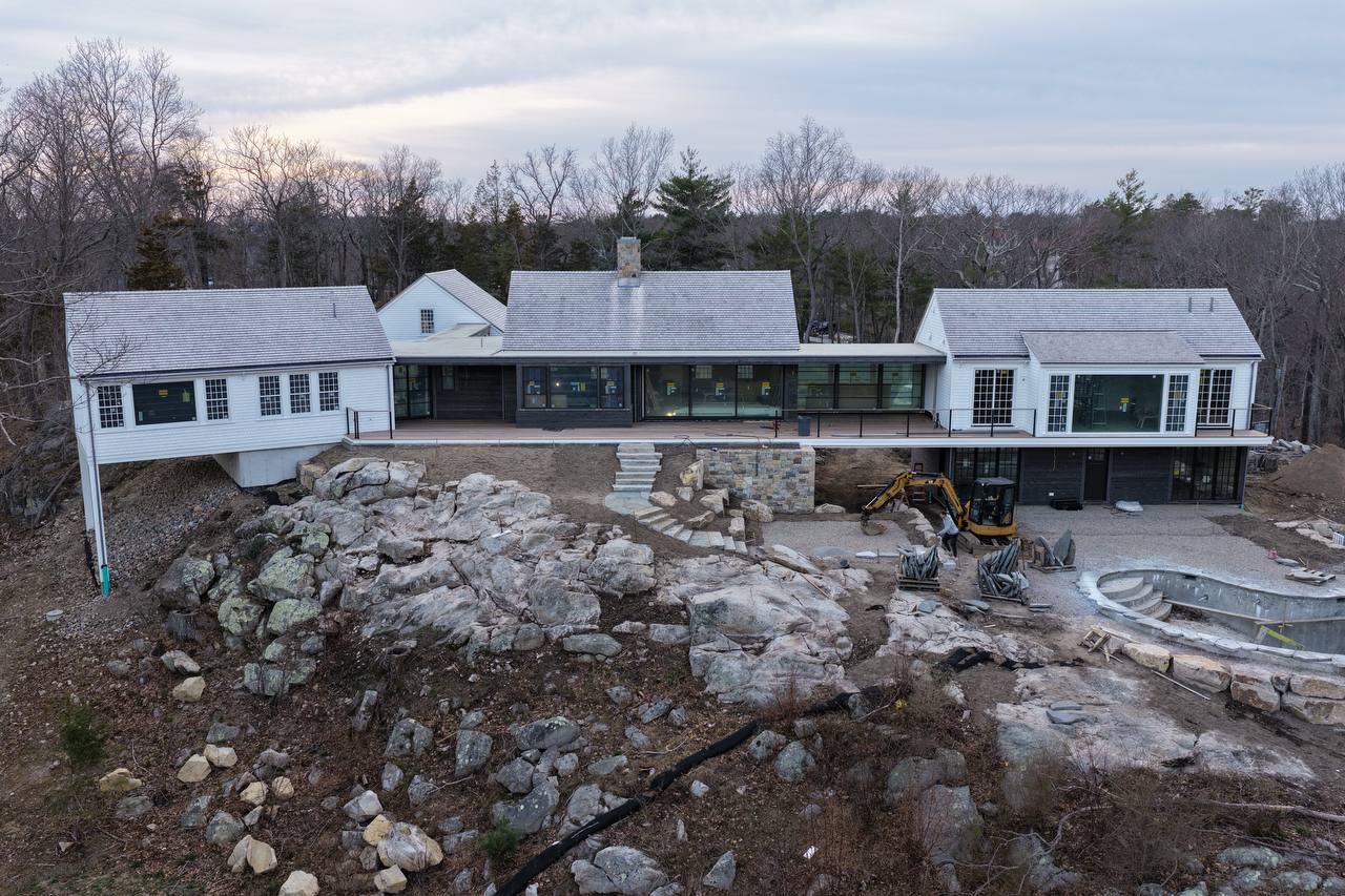 Luxury coastal home with Alaskan Yellow Cedar roof and white cedar siding