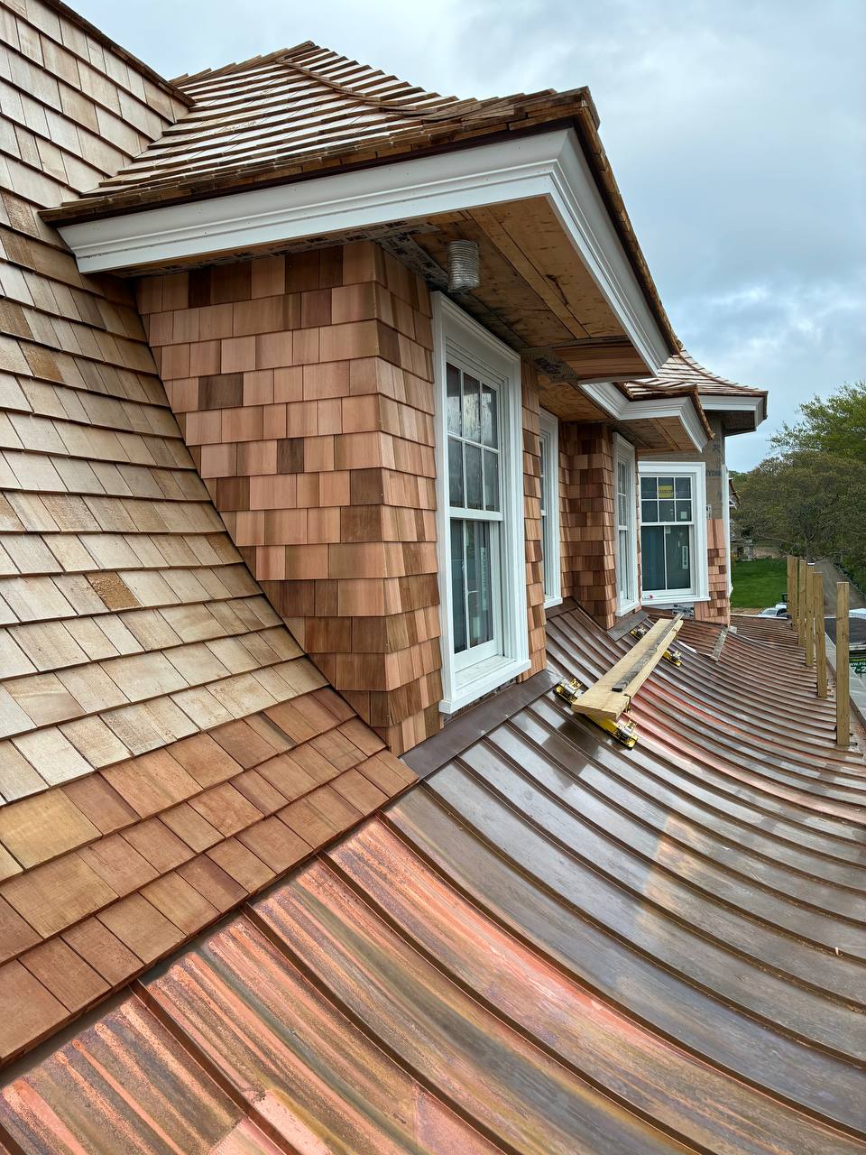 Red cedar roof and sidewall installation - view 1
