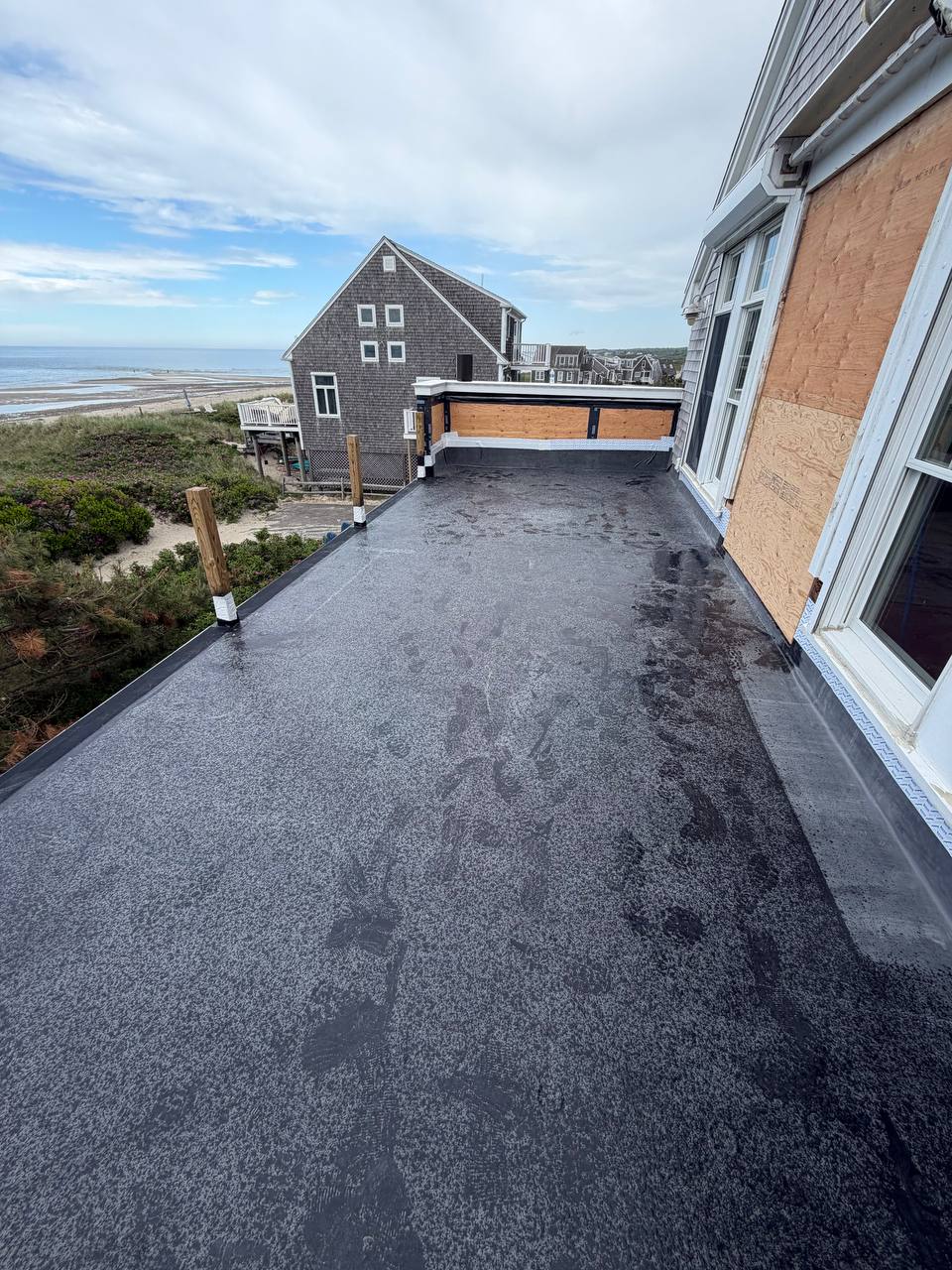EPDM flat roof replacement Sandwich MA with ocean view