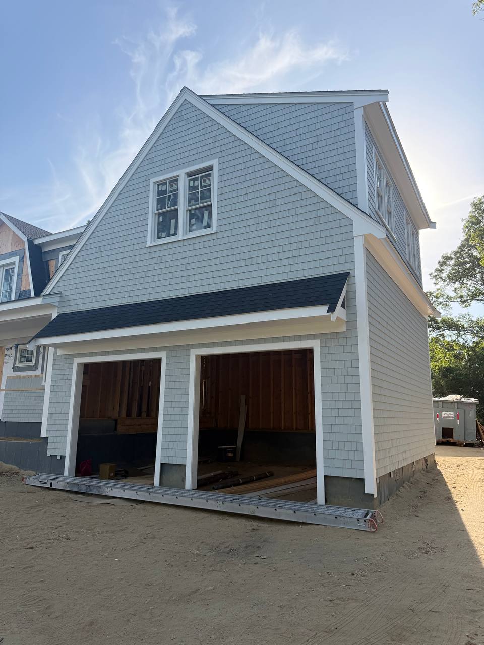 Cedar shingle siding on garage and main house