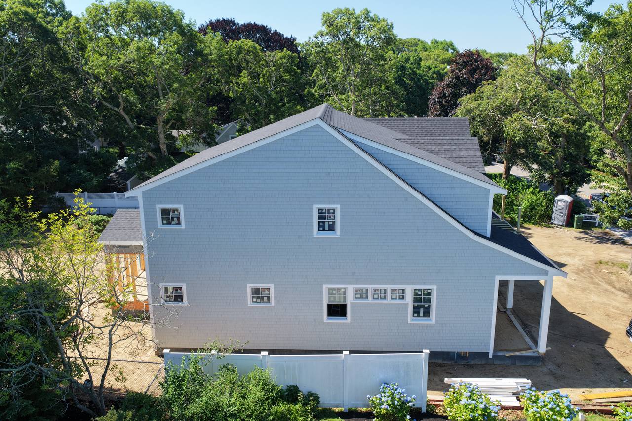 Side gable end wall white cedar shingle detail