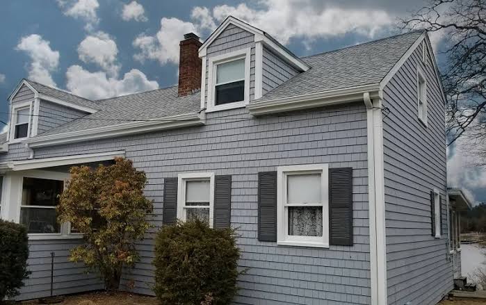 Premium vinyl siding installation on a coastal Cape Cod home