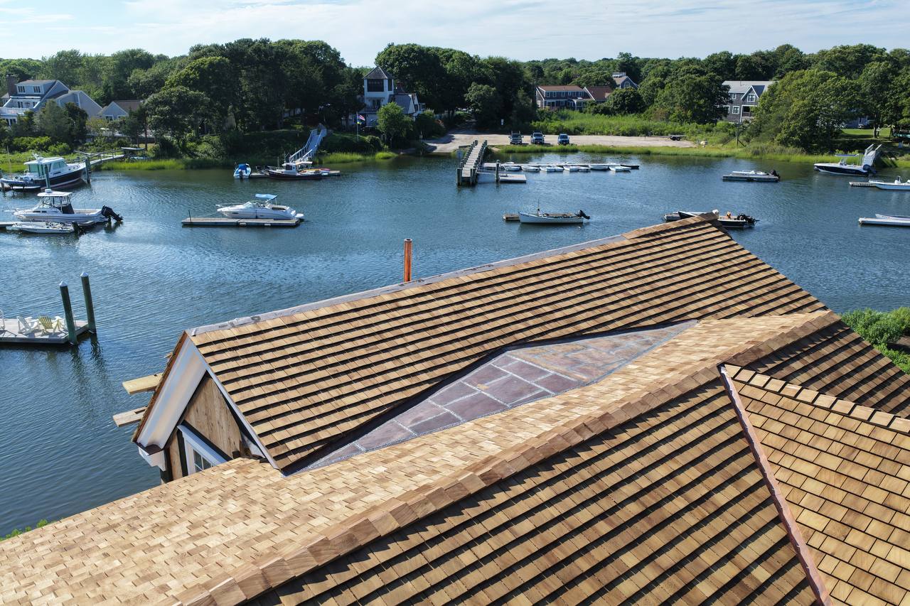 Detached garage with cedar shingle roof and copper breezeway roof