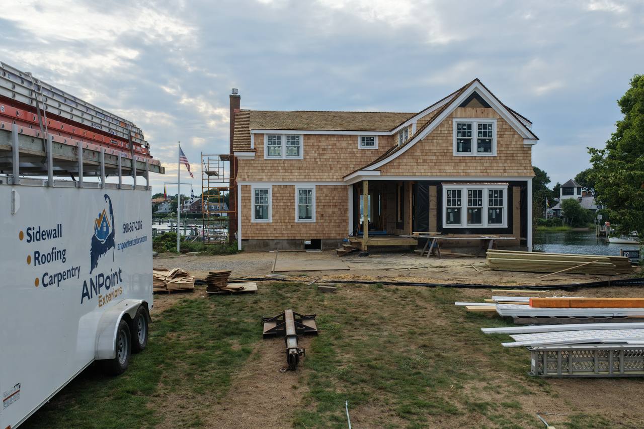 Centerville home with white cedar sidewall installation in progress