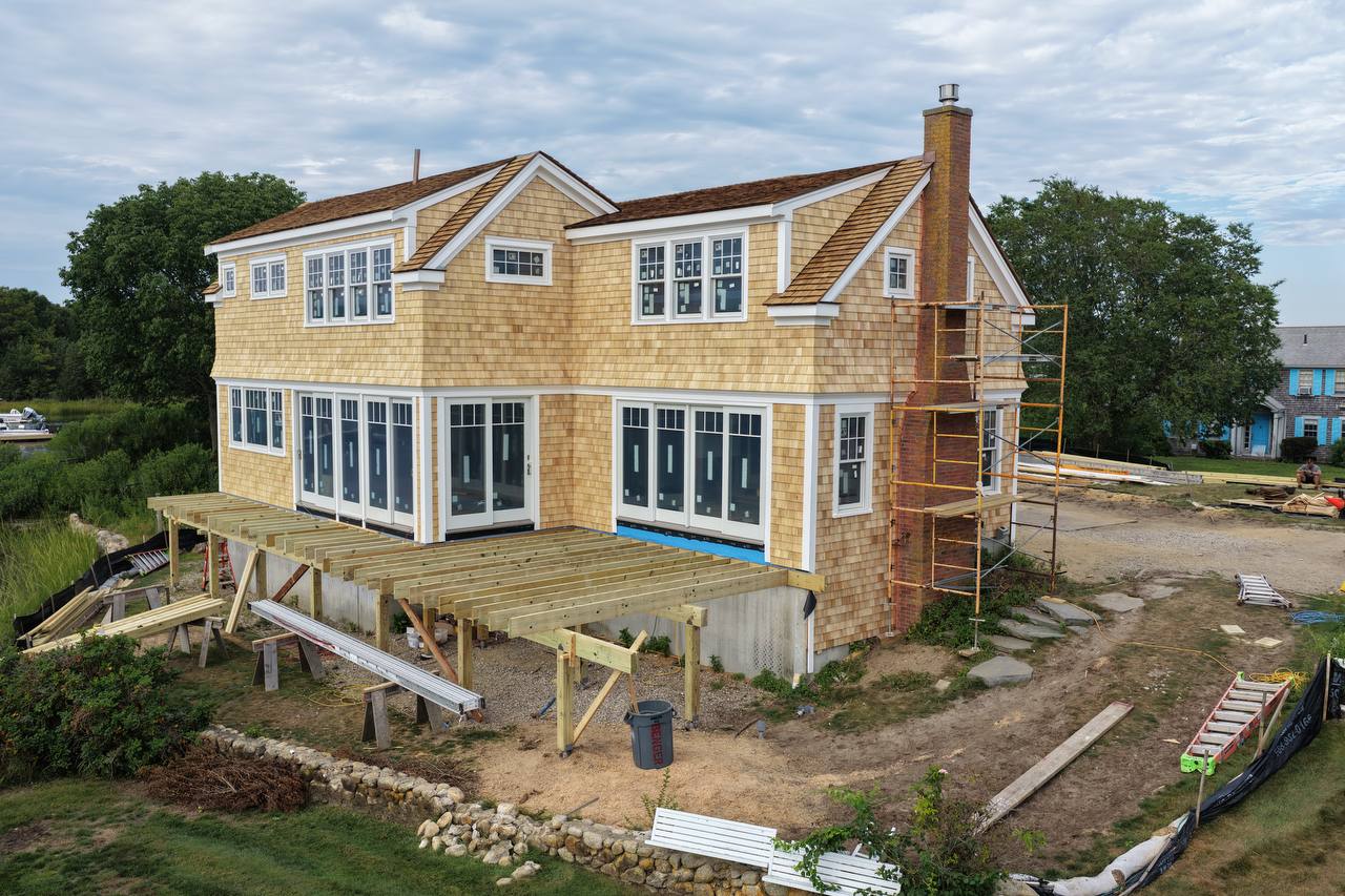 Close-up of white cedar shingle courses and corner detail
