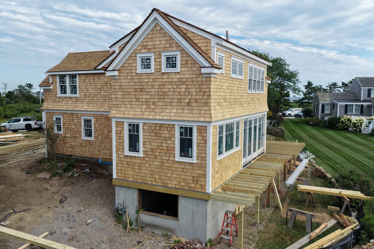 Full exterior view of the house with white cedar shingles
