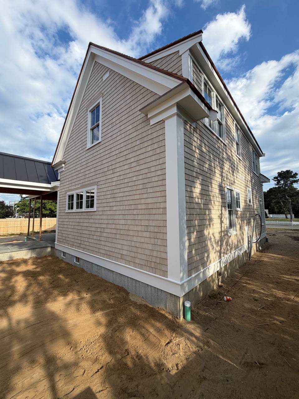 Red cedar roof with weaved caps and white trim