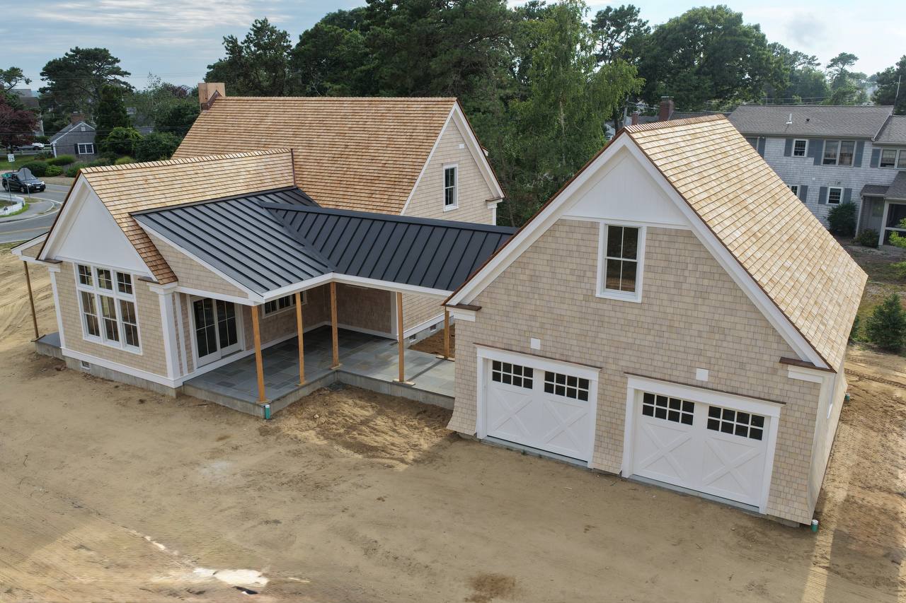 Standing seam metal roof and red copper flashing in detail