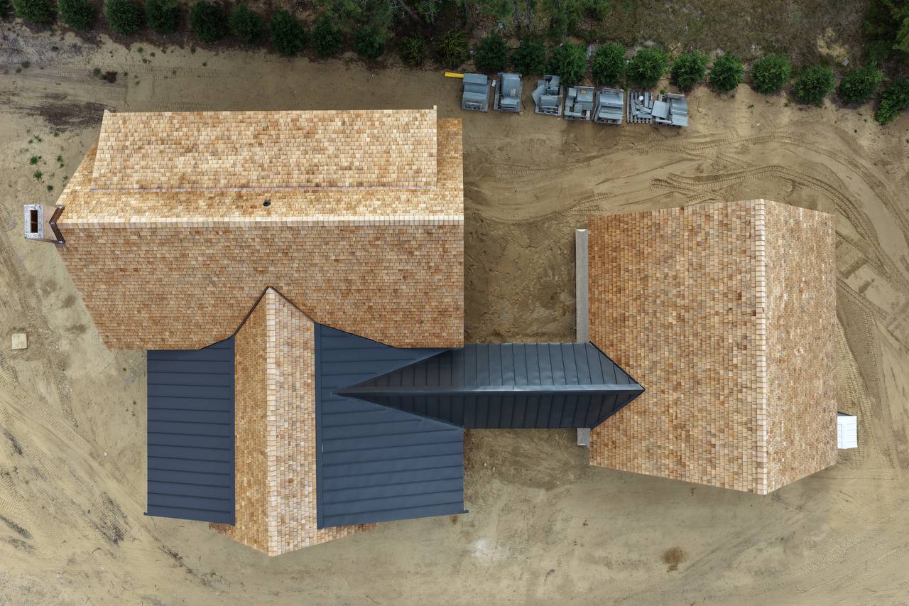 Standing seam and red cedar roof final view